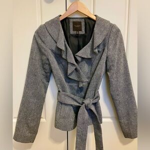 Gray blazer with ruffled front and tie.
